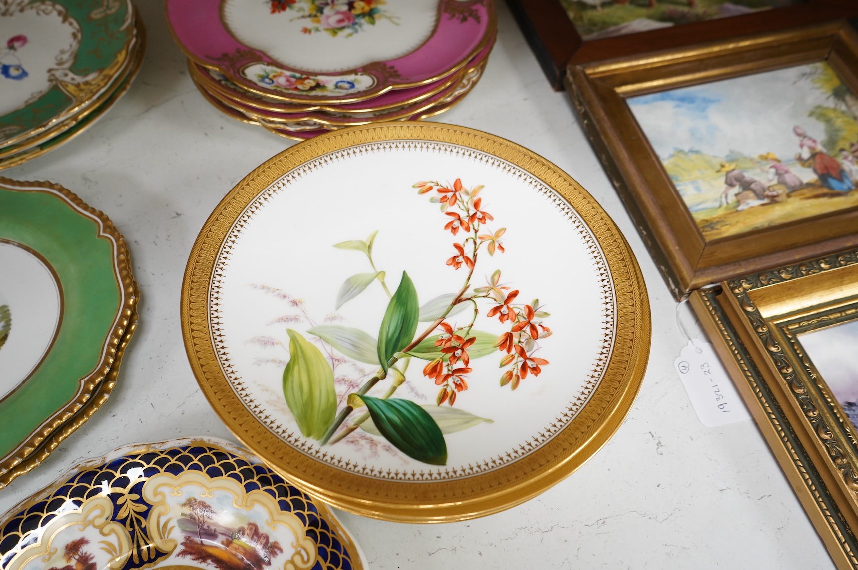 A collection of 19th century English dessert wares to include a pair of Flight, Barr and Barr ‘fantastic birds’ green ground dessert plates, various Ridgway dessert plates, five Minton botanical plates with tooled gilt b